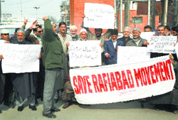 Residents of Watergam hold a protest in Srinagar on Monday. Tribune photo: Yawar Kabli 