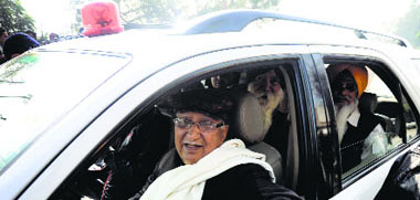 former Health Minister Satpal Gosain in his red beacon vehicle during the protest.