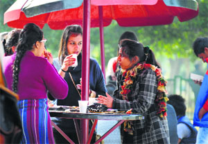 Students enjoy tea on the PAU campus on a sunny day in Ludhiana on Monday.
