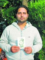Meet Anmol with his pocketbook 'Meet Praga' in Ludhiana. 