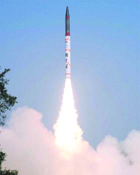Fire power: Agni-IV, the 4000-km range nuclear capable ballistic missile, is successfully launched from Wheeler Island off the coast of Odisha on Monday