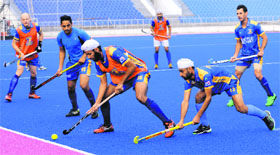 Players of Punjab Warriors during a practice session at the new hockey stadium in Phase IX, Mohali on Tuesday.