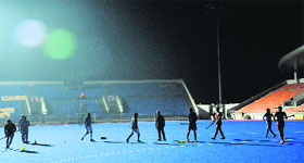 only one floodlight is on during a practice session at the hockey stadium in Mohali on Tuesday.