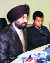 UT SSP Sukhchain Singh Gill with the victim at the Sector 9 police headquarters in Chandigarh on Tuesday.