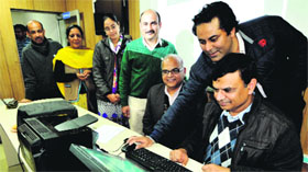 DSW Prof Navdeep Goyal being briefed regarding online application at Panjab University.
