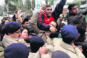 BPEd and MPEd pass unemployed youths stage a protest at the Rispana Bridge barricades, near the Vidhan Sabha, in Dehradun on Tuesday