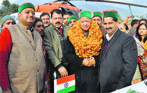 Forest Corporation vice-chairman Kewal Singh Pathania welcomes Chief Minister Virbhadra Singh on his arrival in Dharamsala on Tuesday. 