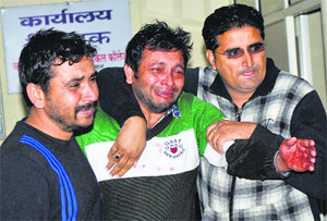 Krishan (centre), brother of deceased Amit, wails at the trauma centre in Karnal on Tuesday.
