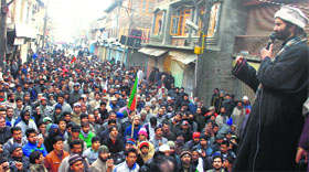 Jammu and Kashmir Liberation Front chairman Mohammad Yasin Malik addresses a gathering in Srinagar on Tuesday.