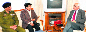 Divisional Commissioner Shantmanu and IGP Rajesh Kumar interact with Governor NN Vohra at Raj Bhawan in Jammu on Tuesday.
