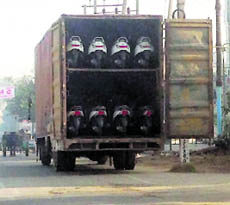 A truck loaded with scooters parked outside New High Senior Secondary School, Sarabha Nagar, in Ludhiana on Tuesday.