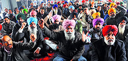 PAU staff hold a protest in Ludhiana on Tuesday