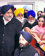 Sukhbir Badal with Barjinder Brar, who took over as the Chairman, Punjab Health Services System, in Mohali on Tuesday