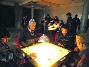 A match in progress in the two-day carrom tournament being held at the Sanatan Dharm temple in Mussoorie on Wednesday
