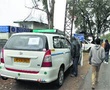 Taxi union officials stop commercial vehicles near Palampur on Wednesday