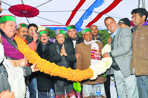 Chief Minister Virbhadra Singh being welcomed by Congress leaders at a public meeting in Baijnath on Wednesday.