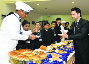 Students of the CT Institute of Hotel Management and Hospitality Administration at a bakery event in Jalandhar on Wednesday. 