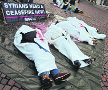 Activists during a protest calling for an immediate end to the war in Syria in Montreux, Switzerland, on Wednesday.