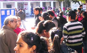 Candidates wait outside the examination hall at the Centre for IAS & Other Competitive Examinations, Panjab University, Chandigarh, on Thursday. Around 300 students took the test to get admission to the centre, which prepares students for Civil Services examinations at a nominal fee. The centre has 50 seats. The result will be declared on Friday