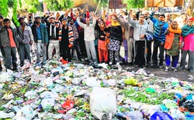 Sanitation workers protest at Phase XI in Mohali on Thursday