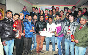 Winners of the carrom tourney with their citations and awards in Mussoorie on Thursday. 