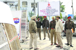 Policemen on guard outside the Enforcement Directorate office in Jalandhar on Thursday. Photo: Sarabjit Singh