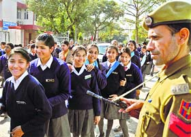 A security personnel keeps a strict vigil outside MA Stadium, main venue of the Republic Day celebrations in the state, in Jammu on Thursday