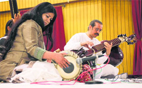 Rudra Veena player Bahaud-din Mohiuddin Dagar and Pakhawaj exponent Chitrangna Agle Reshwal perform at the Ramgarhia Girls College in Ludhiana on Thursday.