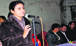 Woman police officer Bhawna Kainthola apprises girls about preventive measures and legal aid against sexual abuse, harassment, and crime at a programme on National Girl Child Day at Town Hall organised in Haridwar on Friday.