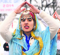A Kashmiri girl performs during a full dress rehearsal for the Republic Day parade at Bakshi Stadium in Srinagar on Friday.