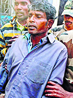 Subalpur village chief Balai Mardi being produced in a court on Friday