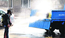 A fire tender tries to bring the situation under control near the tubewell in Sector 21, Chandigarh, on Saturday. Tribune photo: Pradeep Tewari