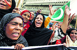 PPP supporters protest the killing of three polio workers in Karachi on January 21