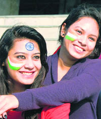 Girls with their faces painted in the colours of the national flag on the eve of Republic Day in Jalandhar on Saturday.