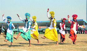Happy moments: Students perform bhangra during the Republic Day parade in Bathinda on Sunday
