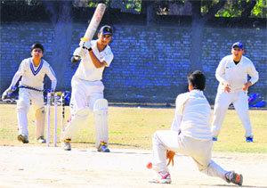 A player hits a shot during a match at Sector 36 in Chandigarh on Monday.