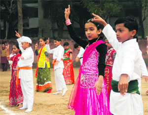 Students of Tribune Model School perform during the Republic Day celebrations in Chandigarh. 