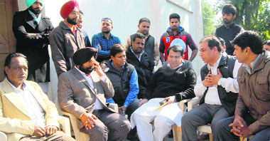 Harmohinder Singh Lucky (second from right), talks to Shakeel Ahmed (third from right) at the Chandigarh Congress Bhawan on Monday.