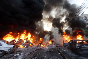 Cars burn after a bomb blast in Beirut on January 2, 2014. In Lebanon various terrorist groups, although powered by the jihadist ideology, either collaborate or work against one another. The equations keep changing every now and then, contributing to confusion.