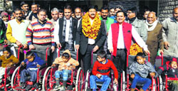 Children on wheelchairs and others at a camp in Kangra. 