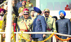 Even as the National Anthem is being played and officials are in 'attention' position, Jails Minister Sarwan Singh Phillaur walks away after hoisting the Tricolour during the Republic Day function at Guru Gobind Singh Stadium in Jalandhar on Sunday. Photo: Sarabjit Singh