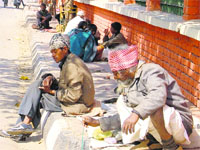 Beggars sit alongside a road in Ludhiana. A file photograph