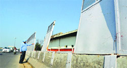 A resident points towards the jinxed area on Elevated Road in Ludhiana on Saturday. Photo: Inderjeet Verma