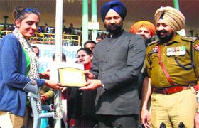 Finance Minister Parminder Singh Dhindsa honours dancer Subhreet Kaur Ghuman in Sangrur on Sunday