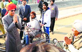 A differently abled man greets Governor Shivraj Patil in Patiala on Sunday