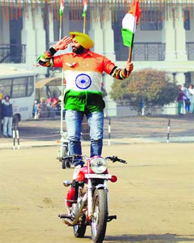 A policeman displays a stunt during Republic Day celebrations