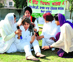 Students stage a play during an awareness programme at the SSD Womens Institute of Technology in Bathinda on Tuesday.