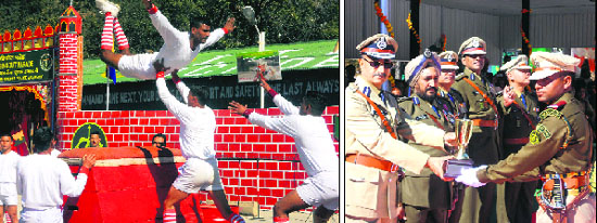 ITBP jawans perform gymnasitcs on the occasion of the passing-out parade in Mussoorie on Tuesday; and (right) the chief guest gives away a citation and a trophy to a subordinate officer inducted into the ITBP.