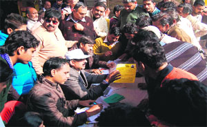 A huge rush for licence forms being distributed and accepted during a camp for traders organised by the district Food and Supplies Department in Haridwar on Tuesday
