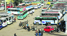 Passengers stranded at the general bus stand in Jammu on Tuesday as transporters went on a strike.